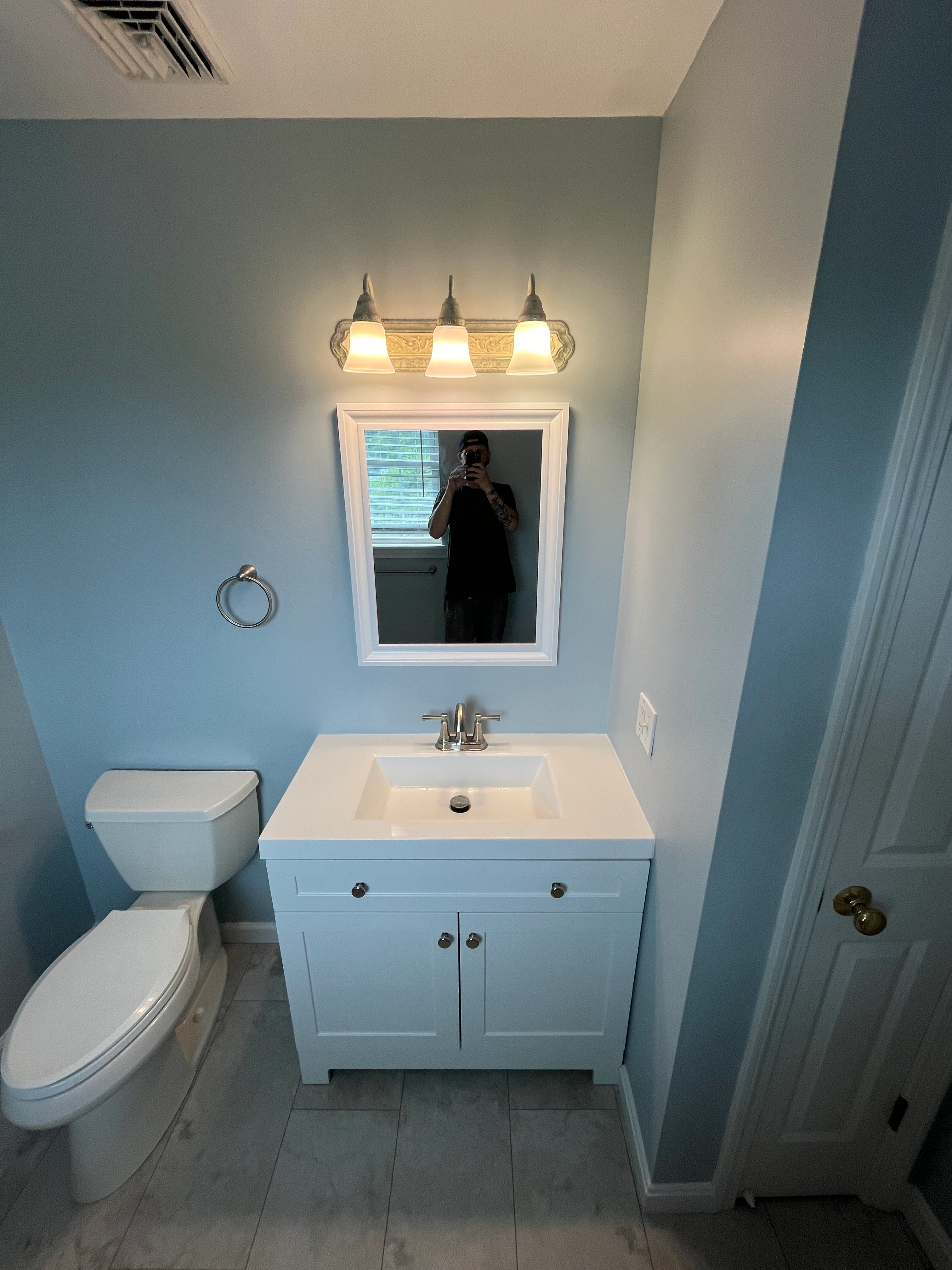 Walk-in shower with white subway tile and niche