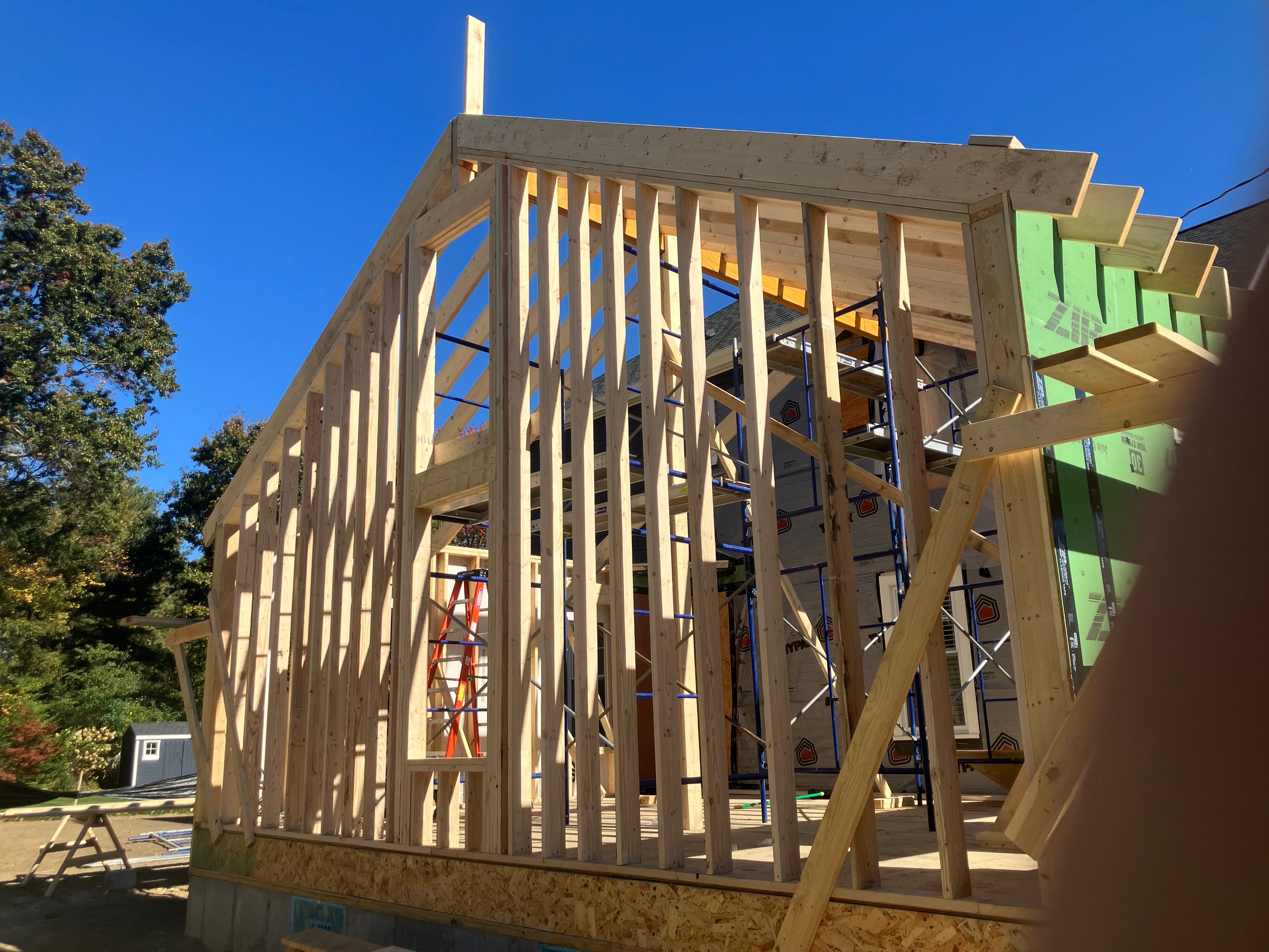 Second-floor addition framing with wall studs and roof structure
