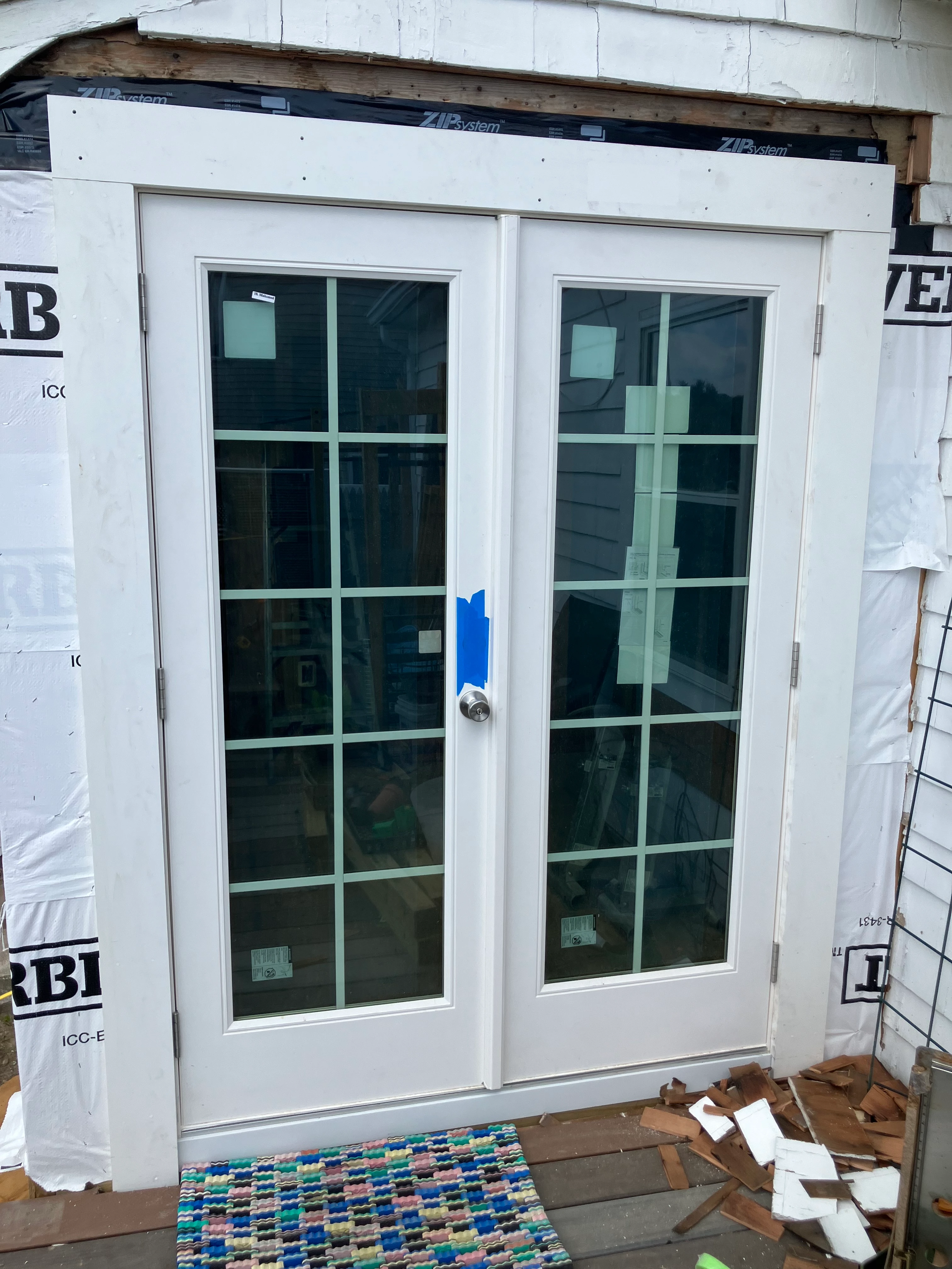 Newly installed French doors with sidelights on a home exterior