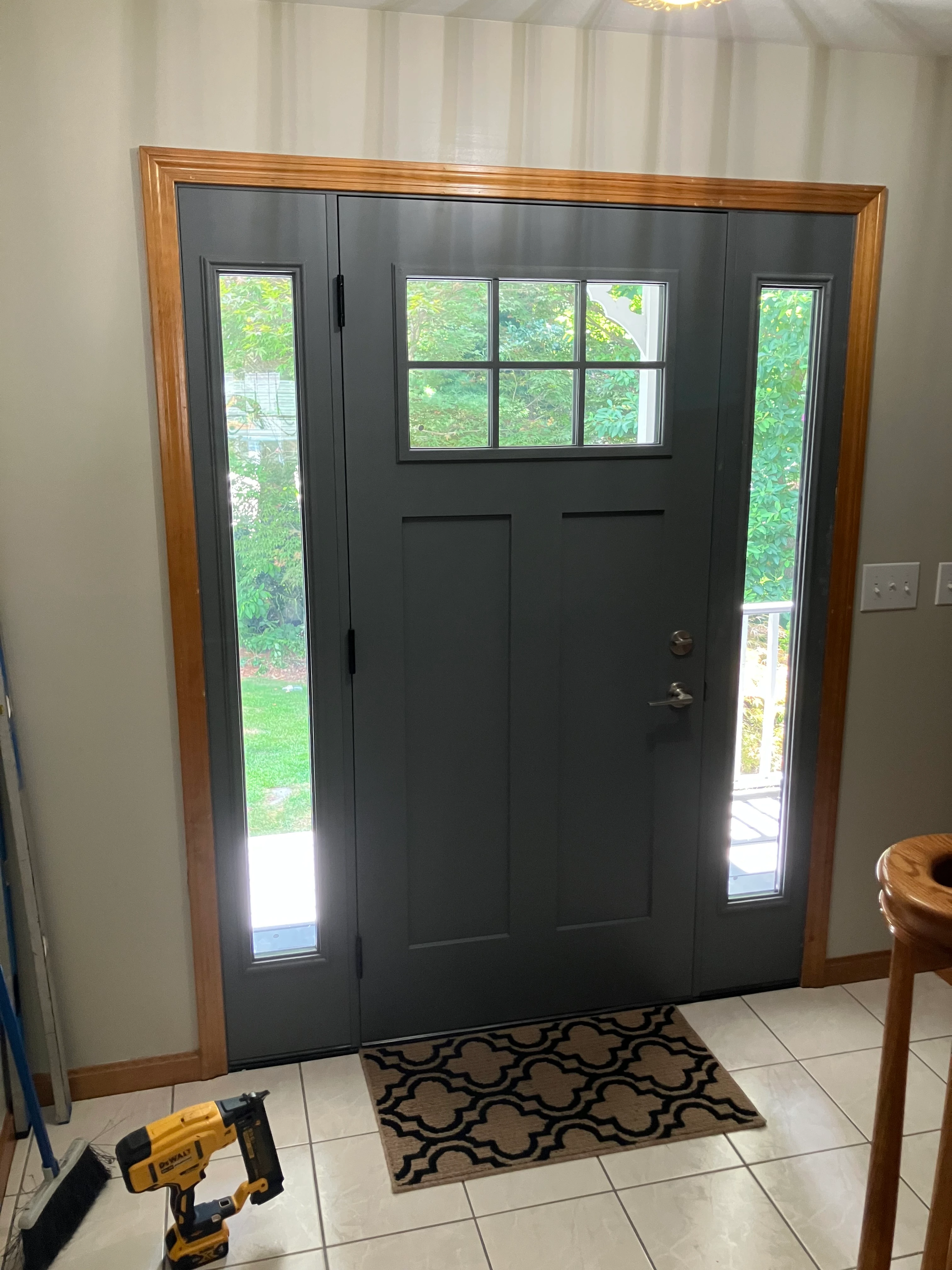 Craftsman entry door with interior casing and trim installed