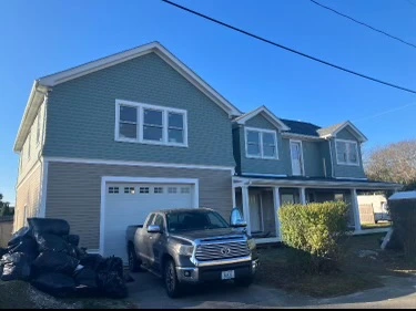 Completed two-story shingle-style exterior from the street