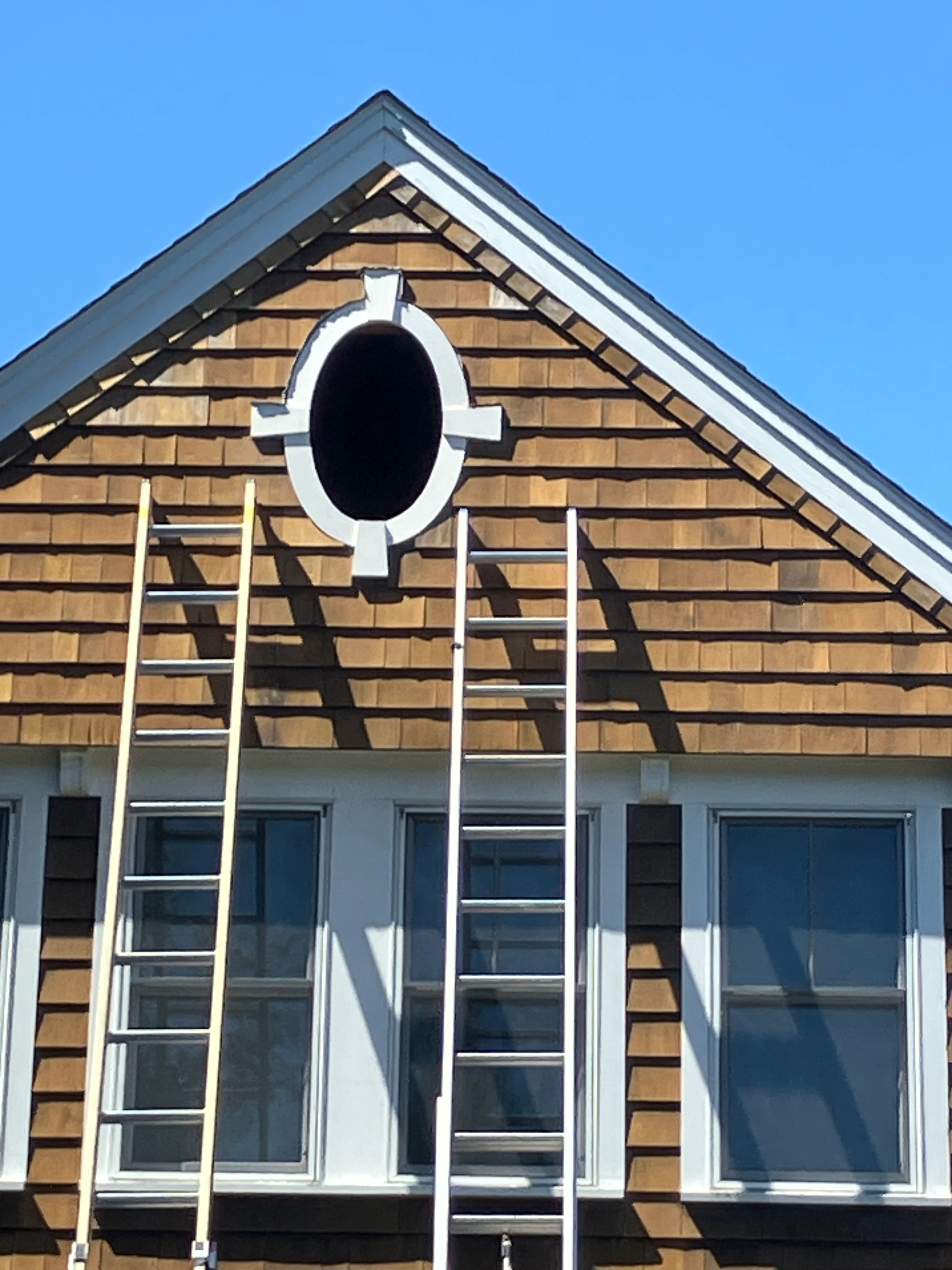 Front gable during cedar shake and trim restoration