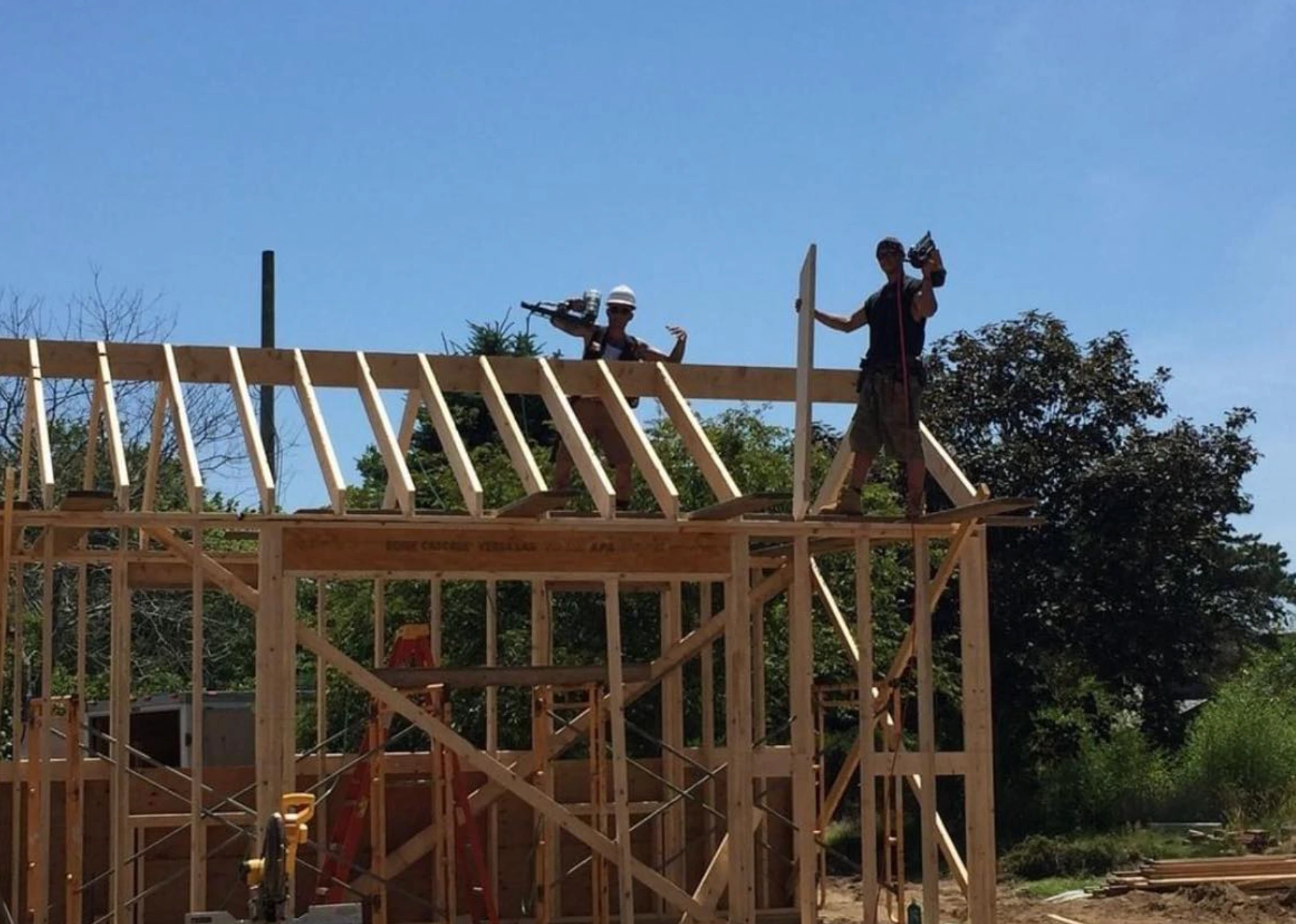 Crew framing the roof structure of the new coastal home