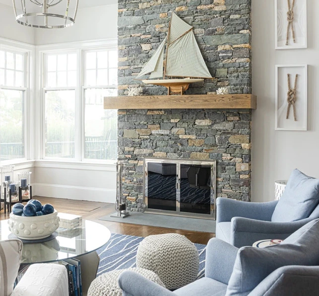 Coastal living room with stone fireplace