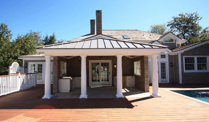 Pool house and outbuildings with bluestone surround